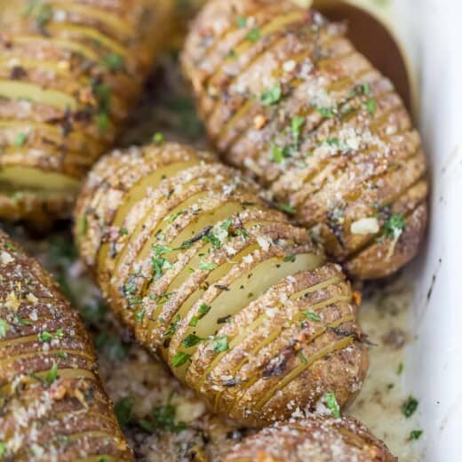 garlic herb hasselback potatoes in a baking dish