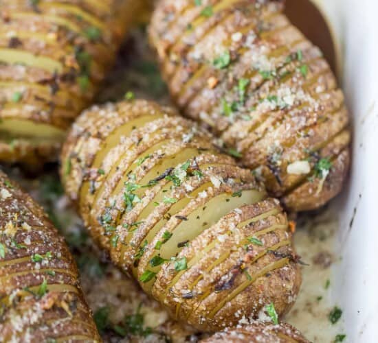 garlic herb hasselback potatoes in a baking dish