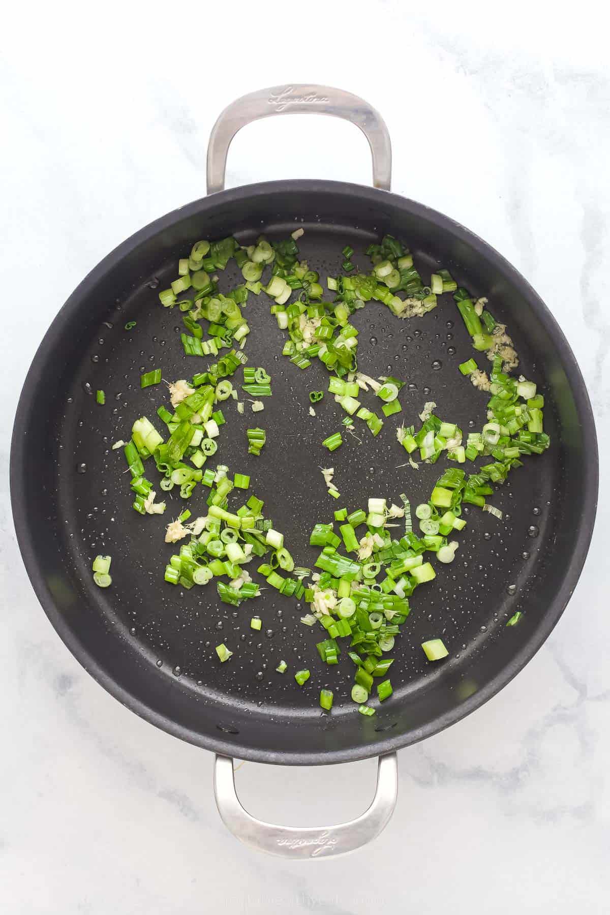 cooked scallions in a pan