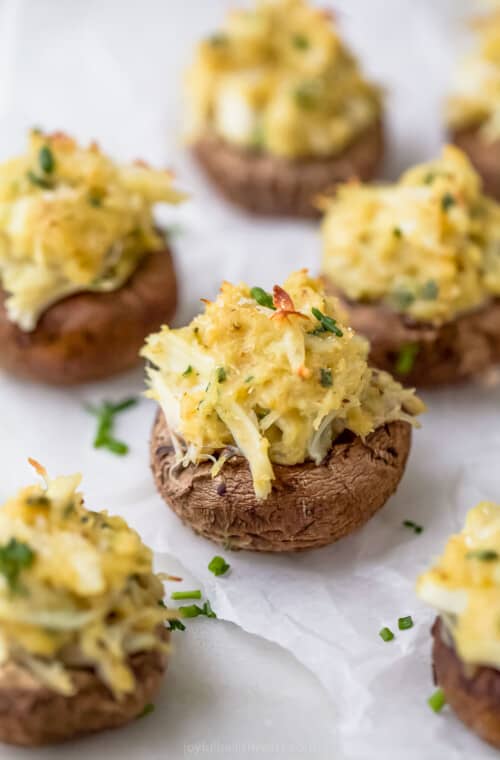 crab stuffed mushrooms with parmesan cheese on top