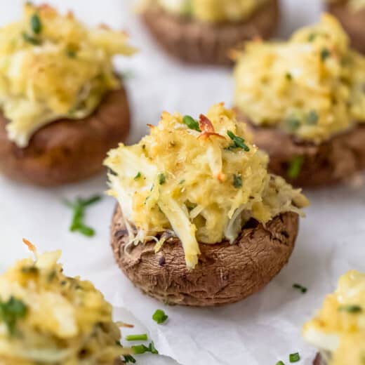 crab stuffed mushrooms with parmesan cheese on top