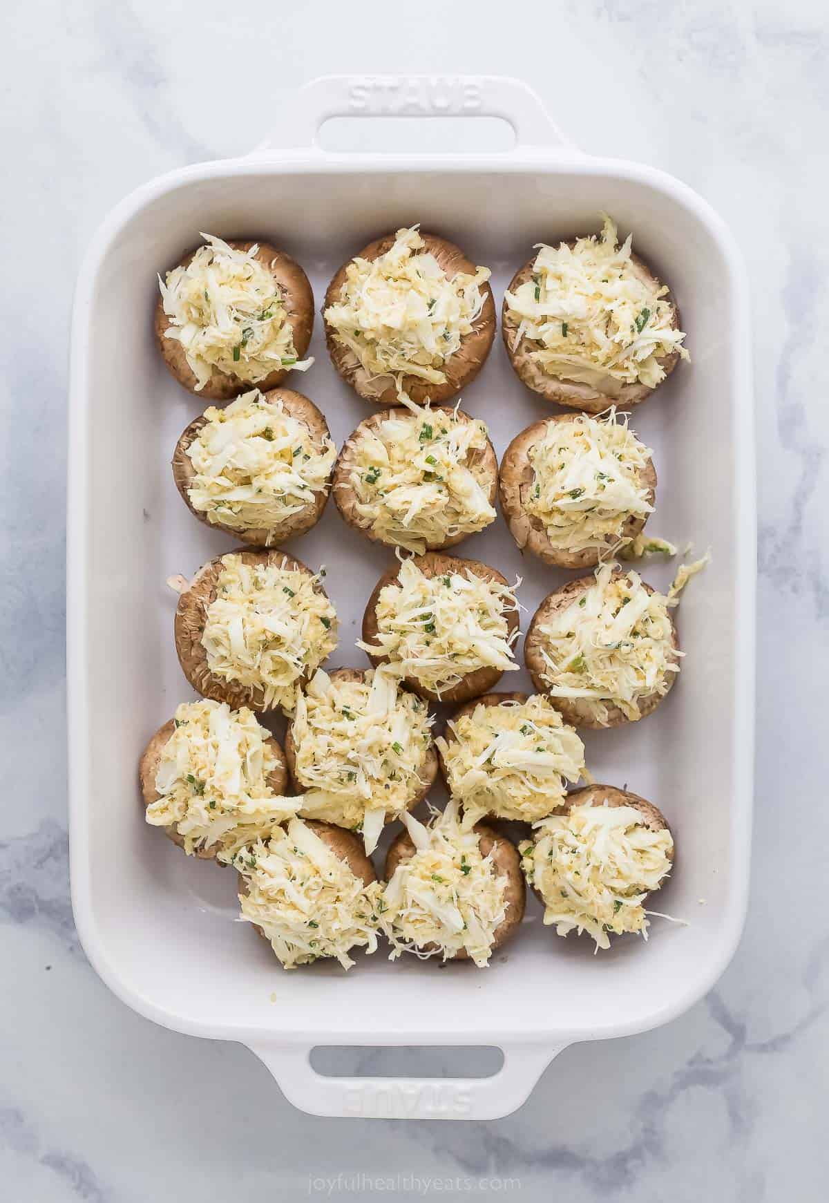 crab stuffed mushrooms in a casserole dish