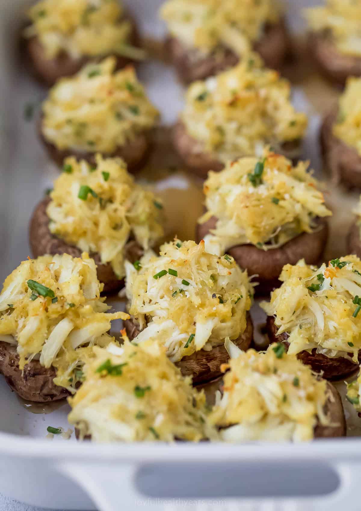 quick crab stuffed mushrooms with parmesan cheese on top