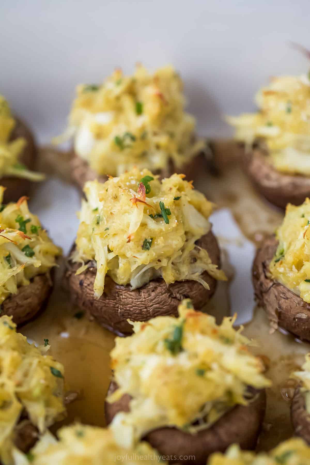 quick crab stuffed mushrooms with parmesan cheese on top