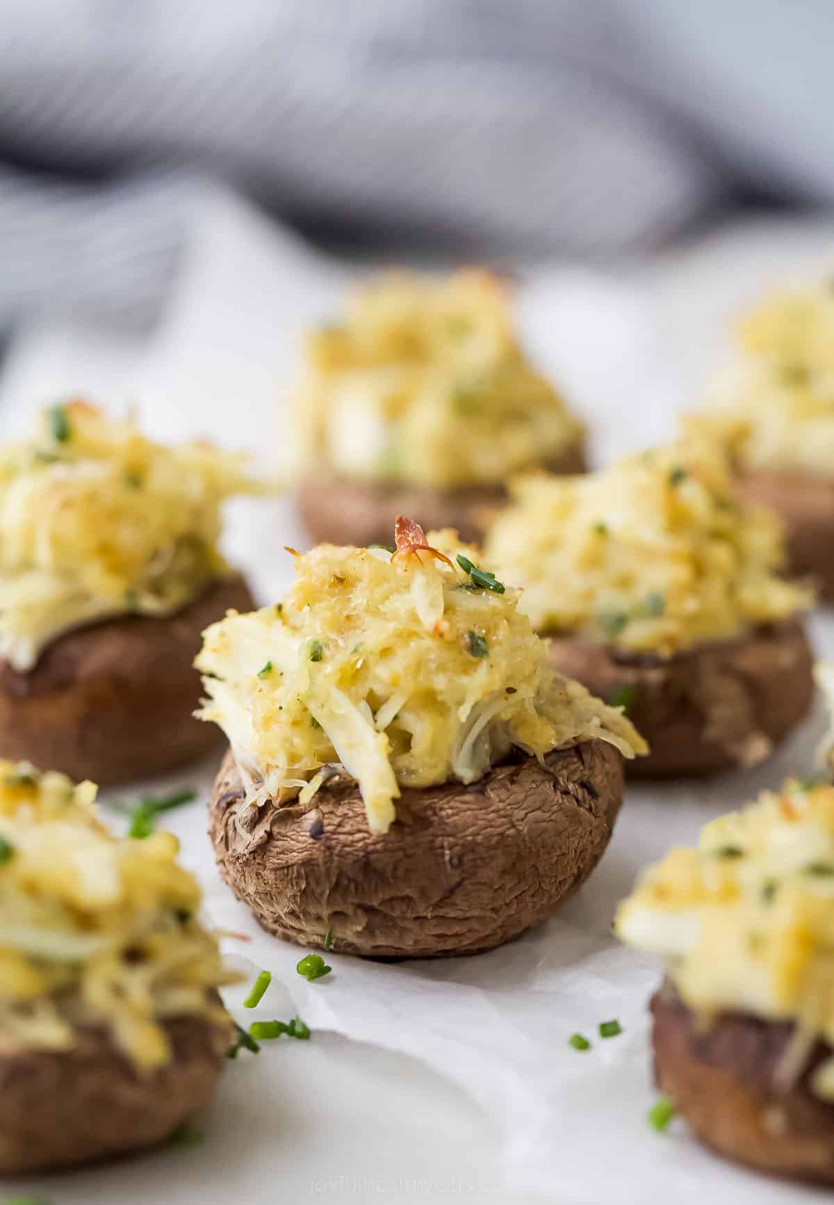 quick crab stuffed mushrooms with parmesan cheese on top