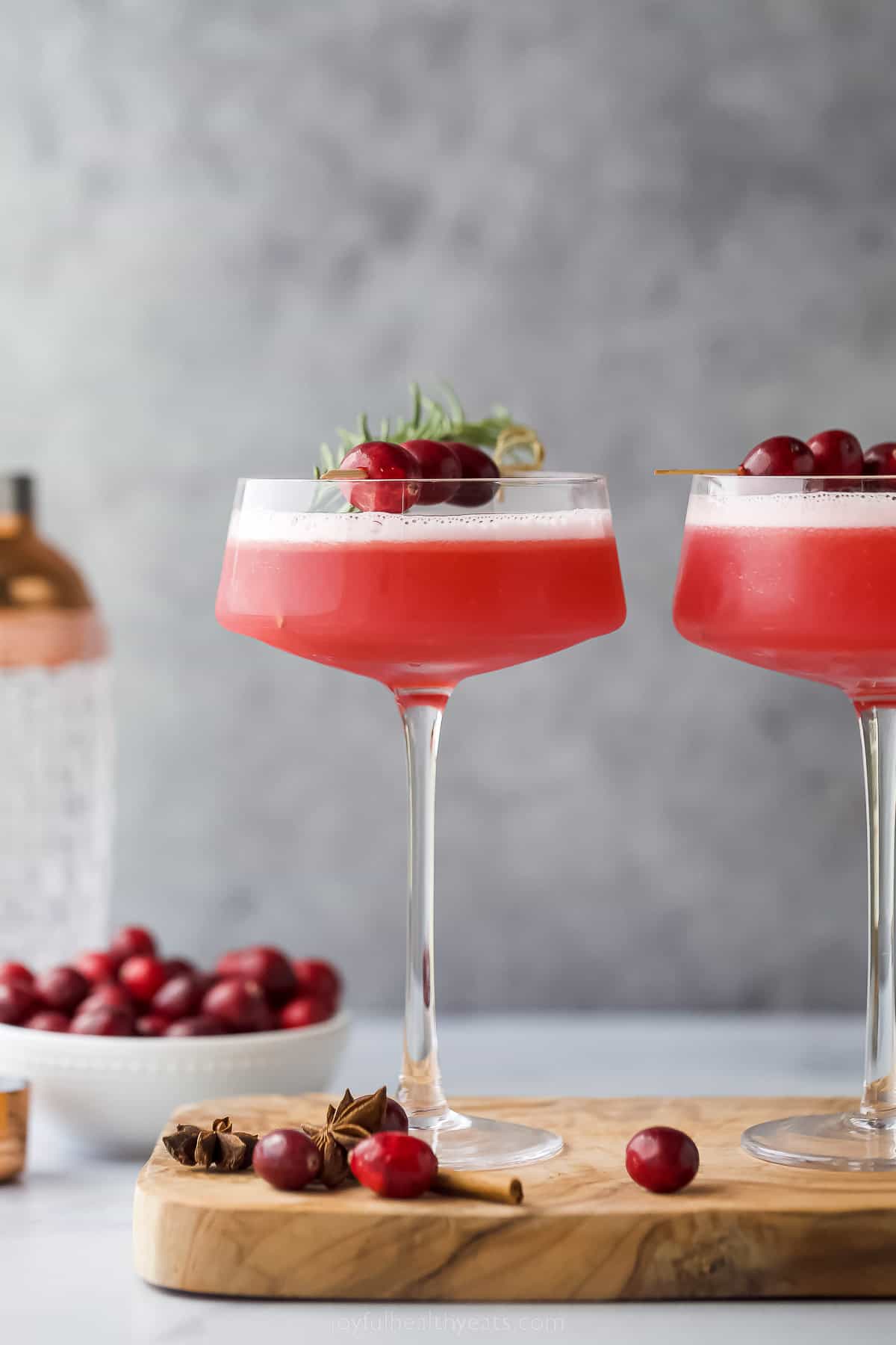 cranberry whiskey sour in a coupe glass