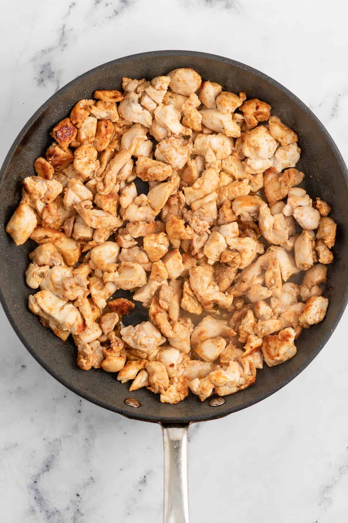 cooked seasoned chicken in a pan