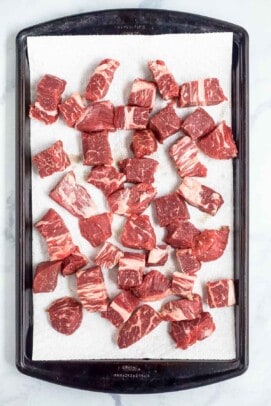 small cuts of beef on a sheet tray