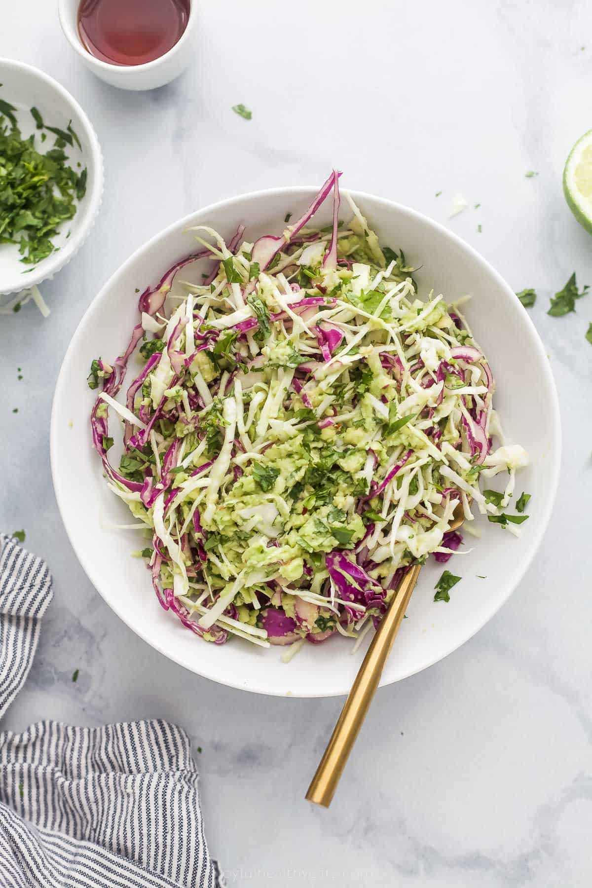 shredded creamy coleslaw for fish tacos in a bowl