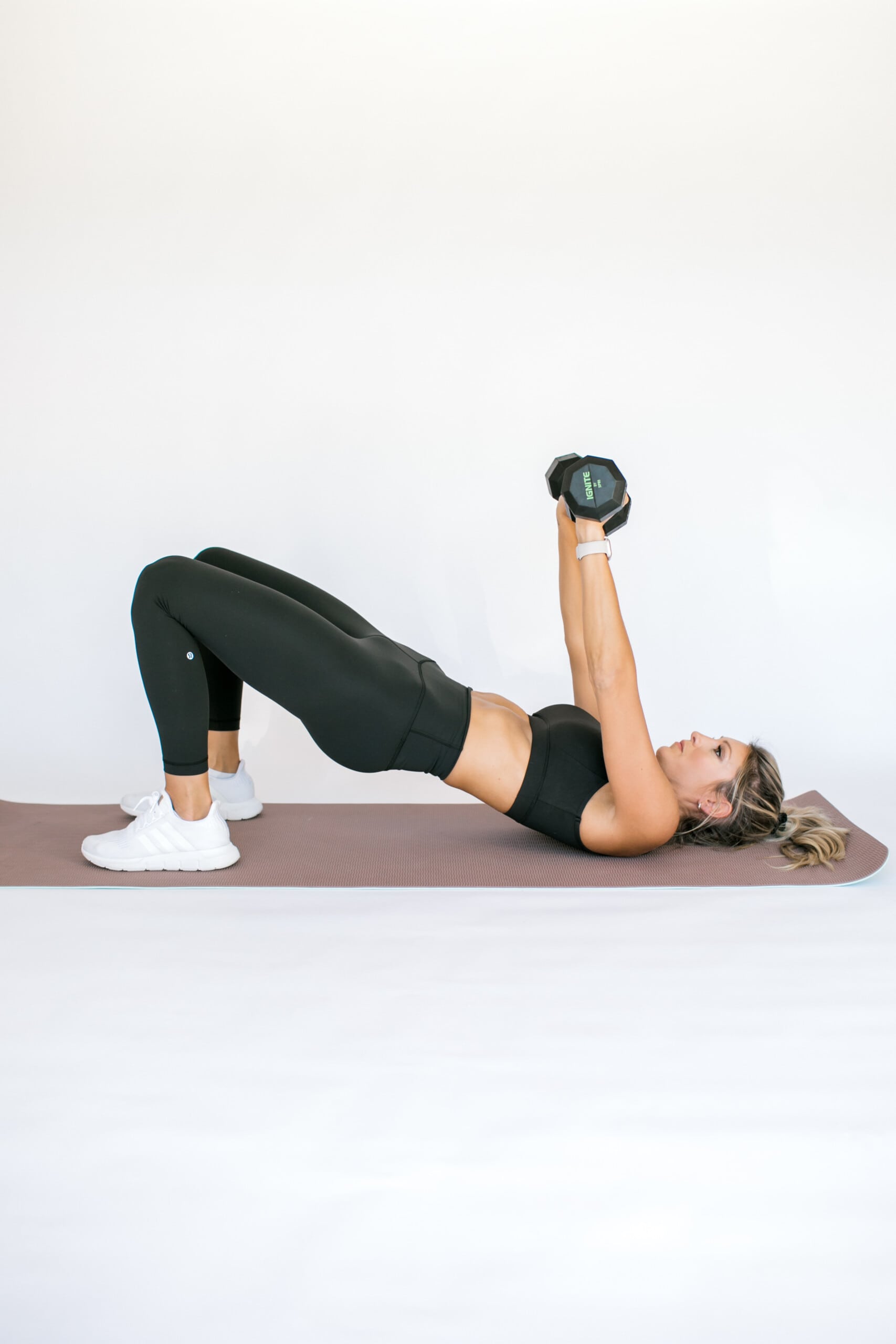 girl in hi8p bridge position doing chest press