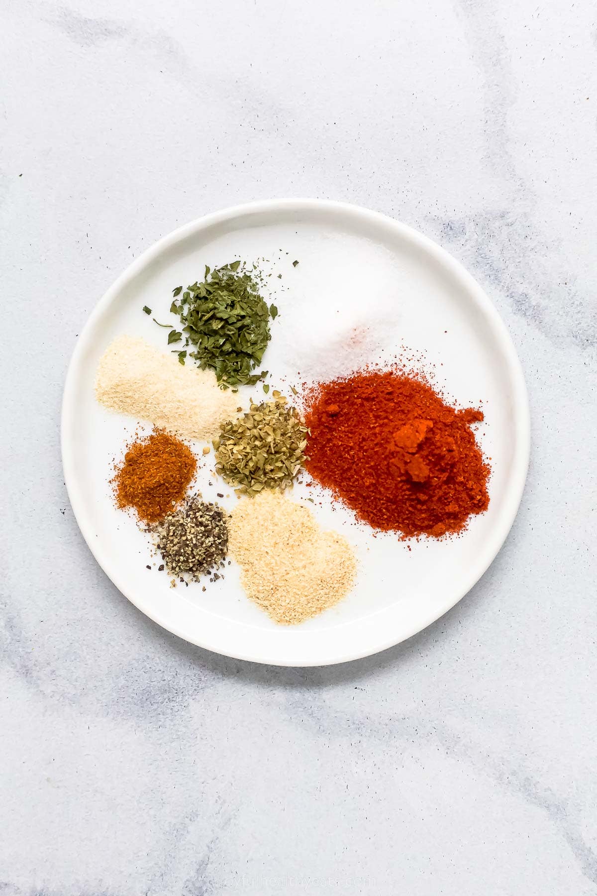 Spices for the blackened seasoning on a plate.