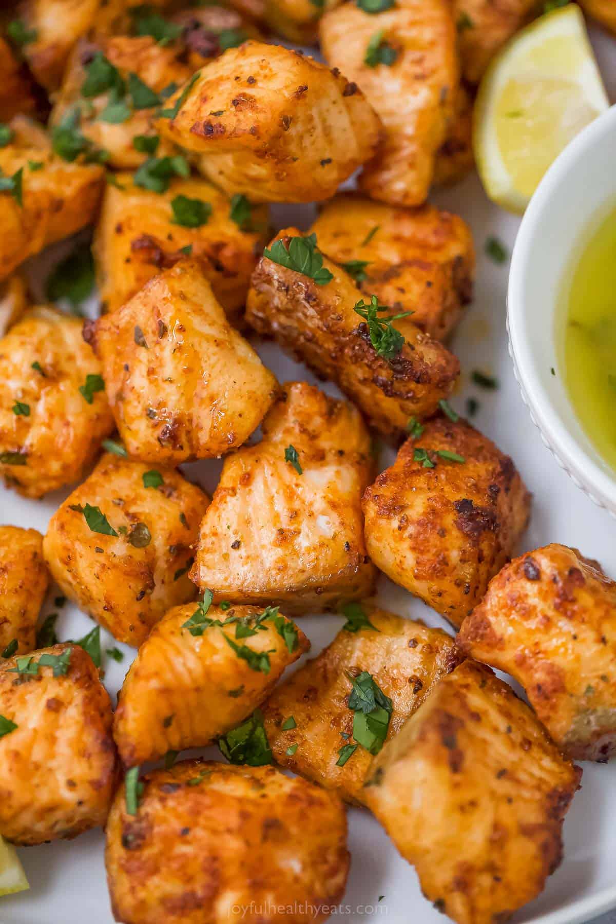 Close-up of air fryer salmon bites. 