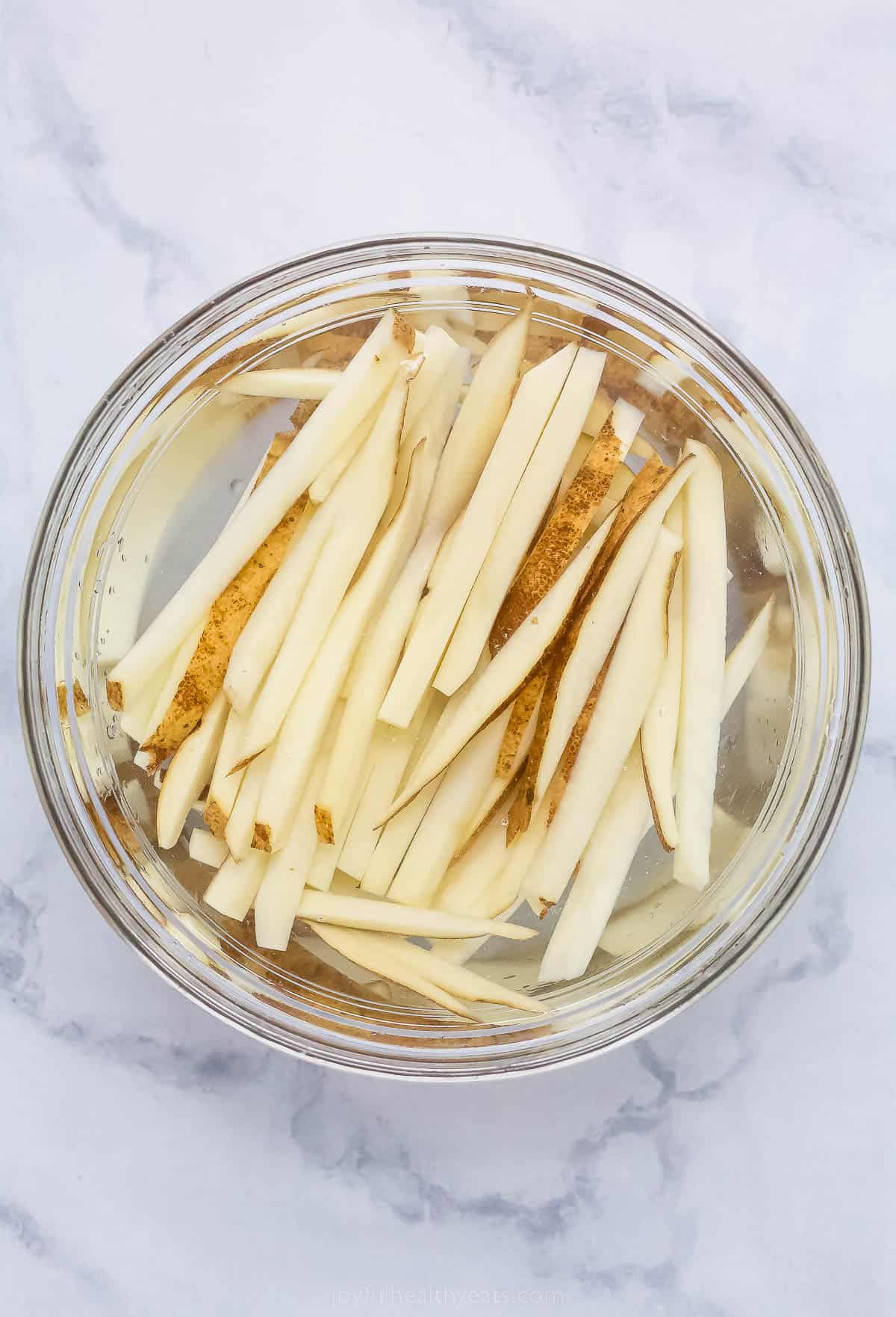 Soaking the fries in cold water.