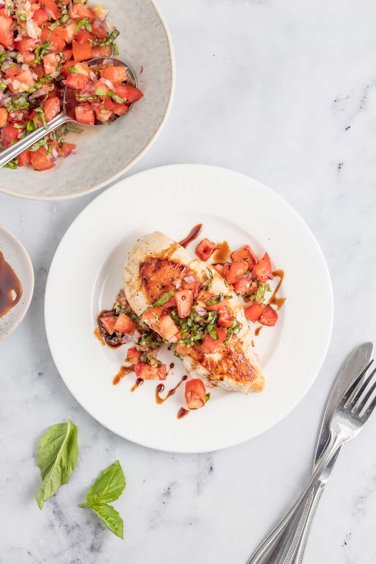 This juicy chicken bruschetta with an Italian-inspired summer veggie topping is the perfect 20-minute healthy but flavorful work lunch. Overhead shot of chicken bruschetta.