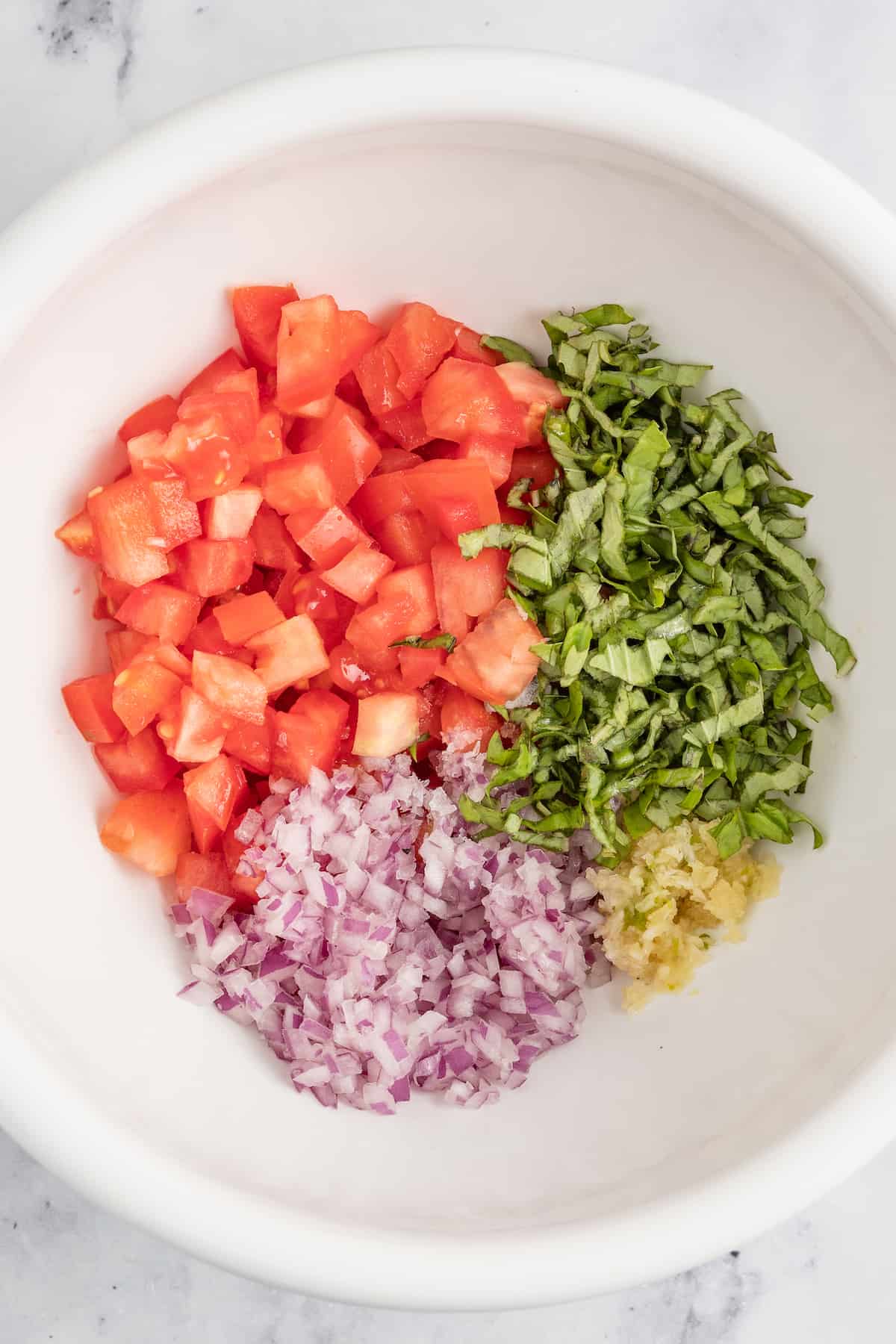 This juicy chicken bruschetta with an Italian-inspired summer veggie topping is the perfect 20-minute healthy but flavorful work lunch. Ingredients for the fresh veggie mixure.
