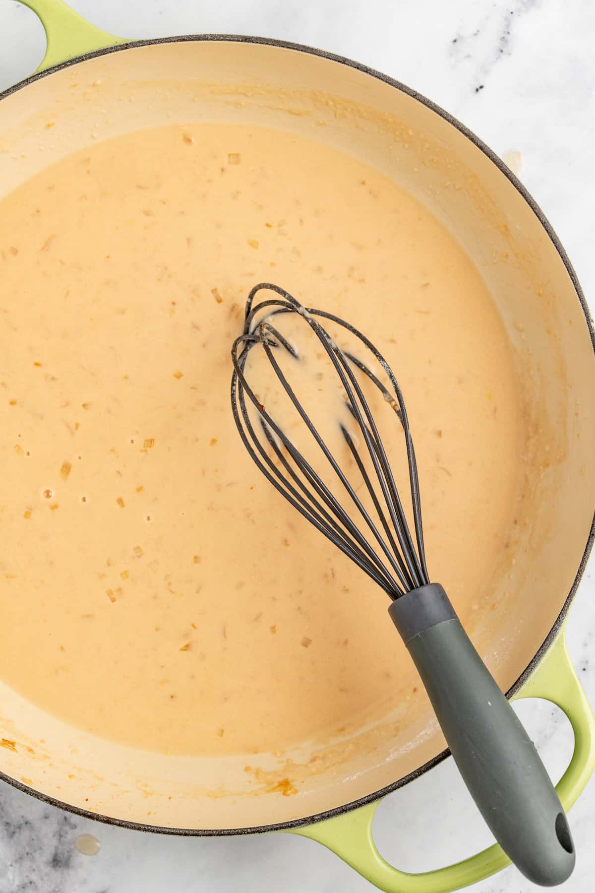 Whisking the sauce. 