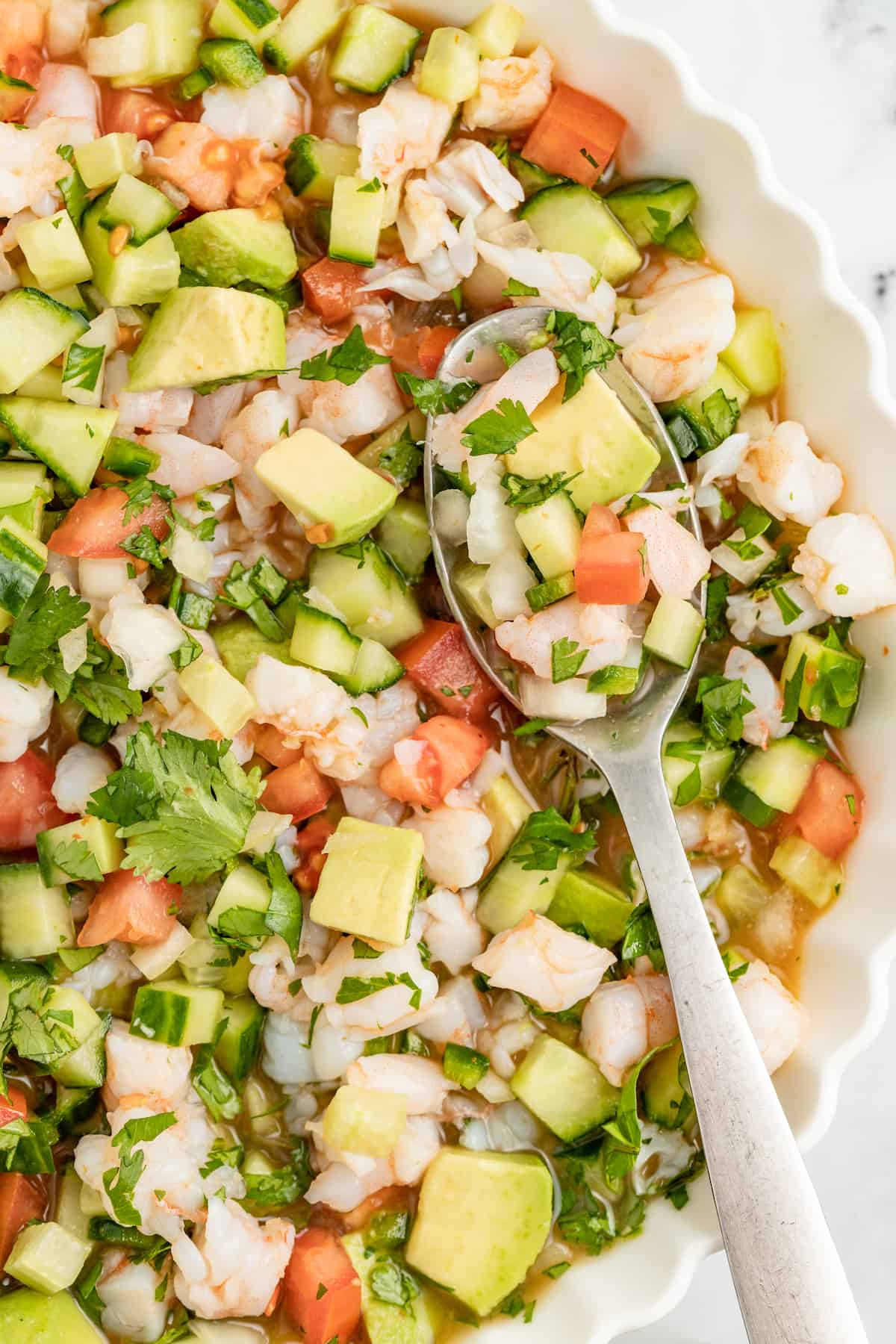 Close-up of spoonful of ceviche de camaron.