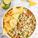 Bowl of ceviche de camaron with tortilla chips.