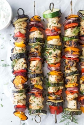 Grilled Mediterranean chicken kabobs with tzatziki on the side.