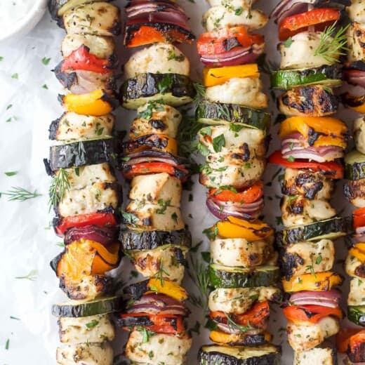 Grilled Mediterranean chicken kabobs with tzatziki on the side.