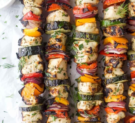 Grilled Mediterranean chicken kabobs with tzatziki on the side.