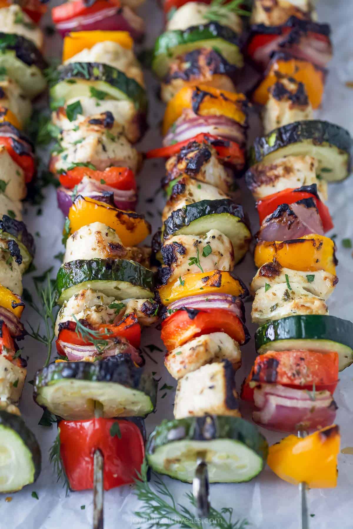 Photo of charred Mediterranean skewers. 