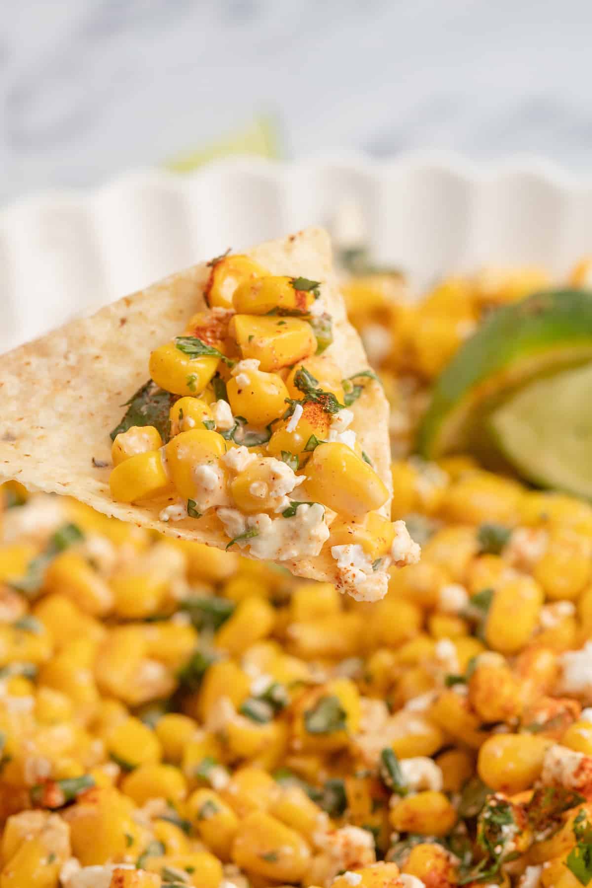 Elote dip on a corn chip.