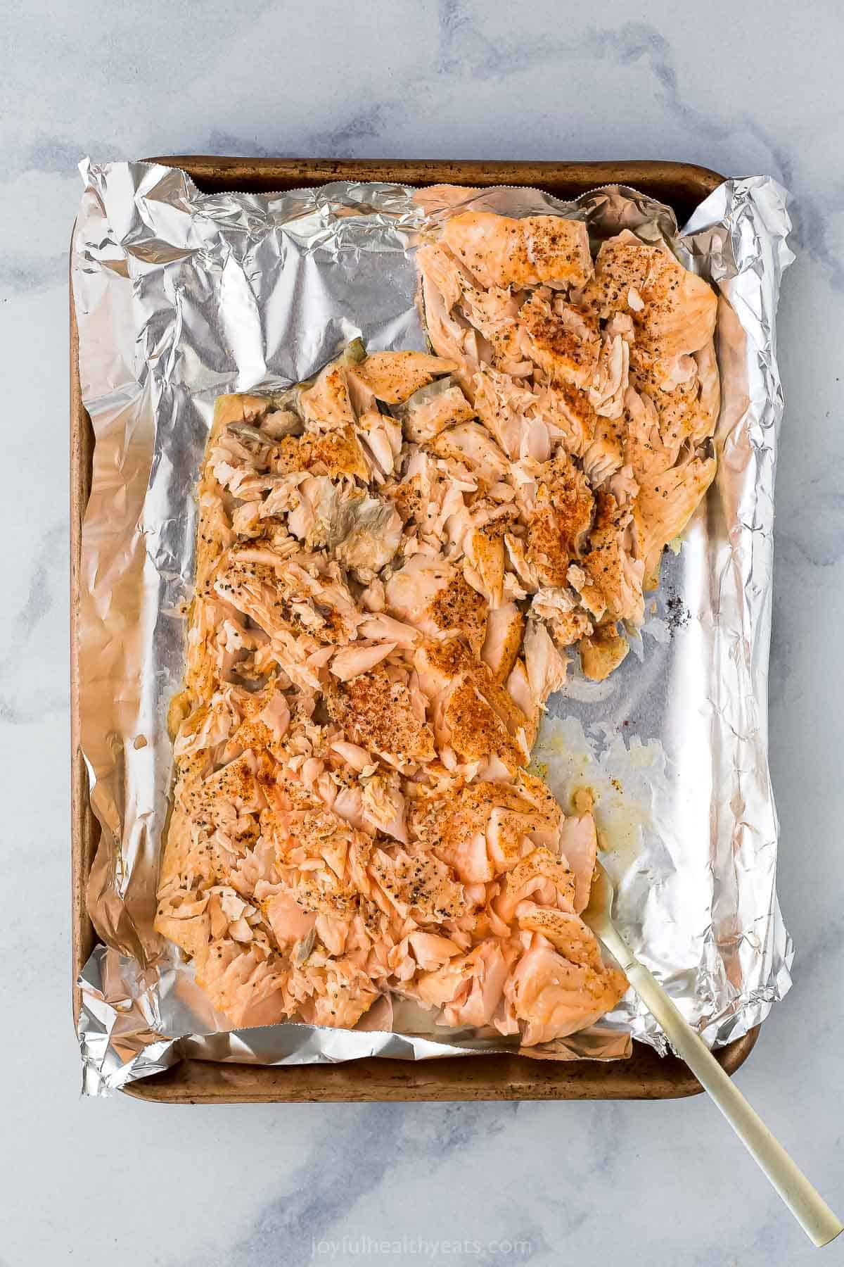 Baked salmon in the baking sheet. 