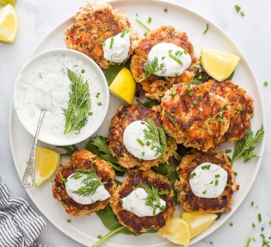 Salmon cakes with lemon dill sauce on the side.