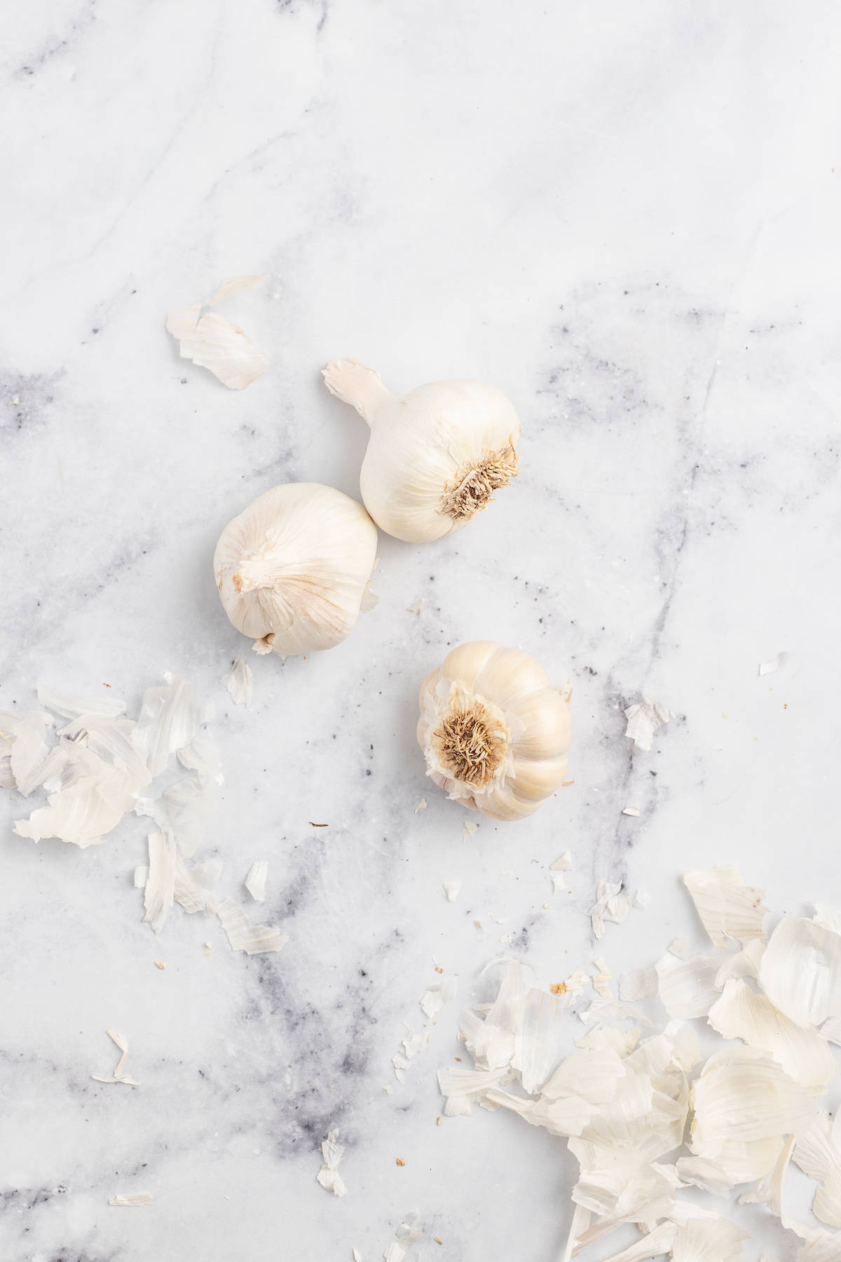 Peeling the garlic bulbs. 