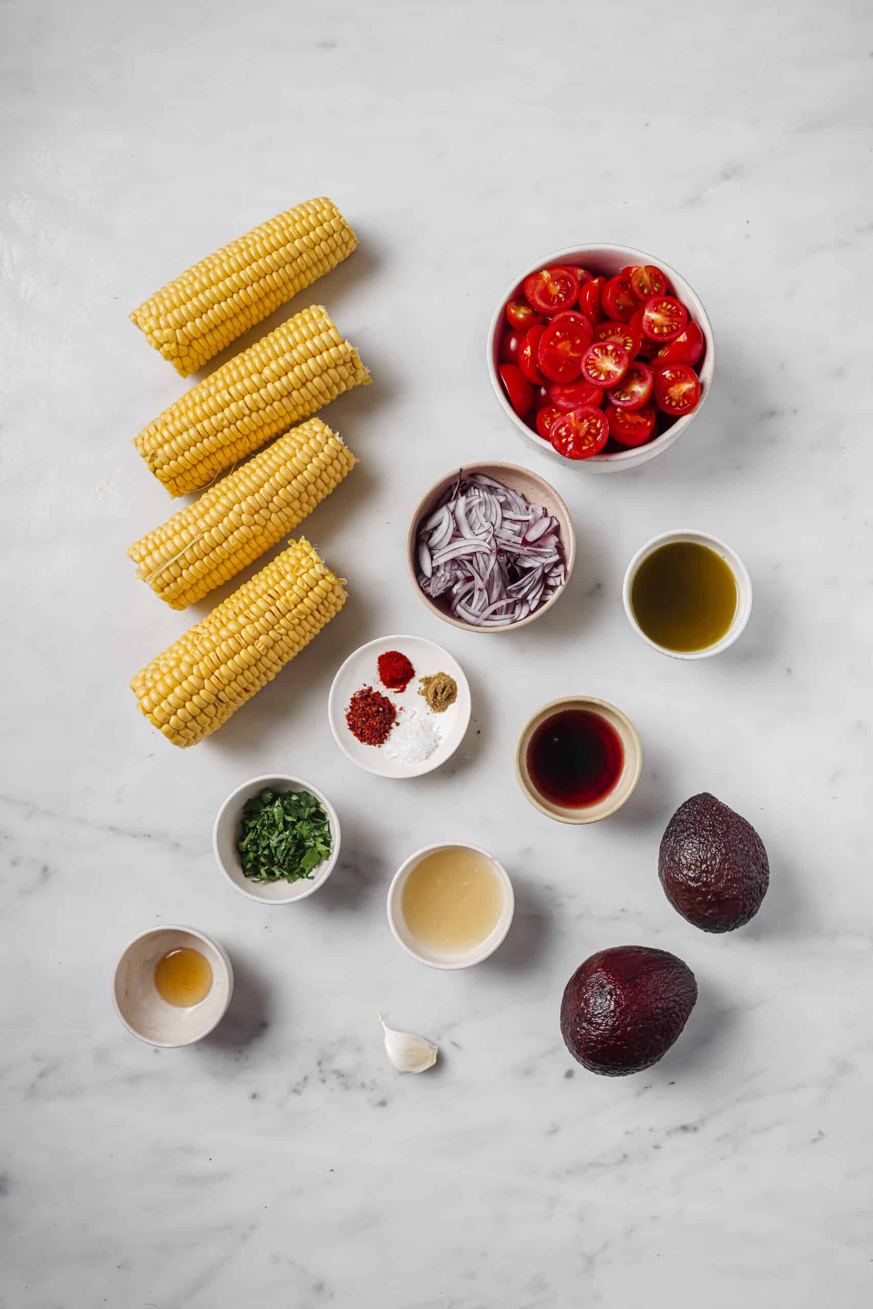 This easy avocado corn salad with a tangy honey dressing will find its way to your menu again and again. It's perfect! Ingredients for avocado corn salad.
