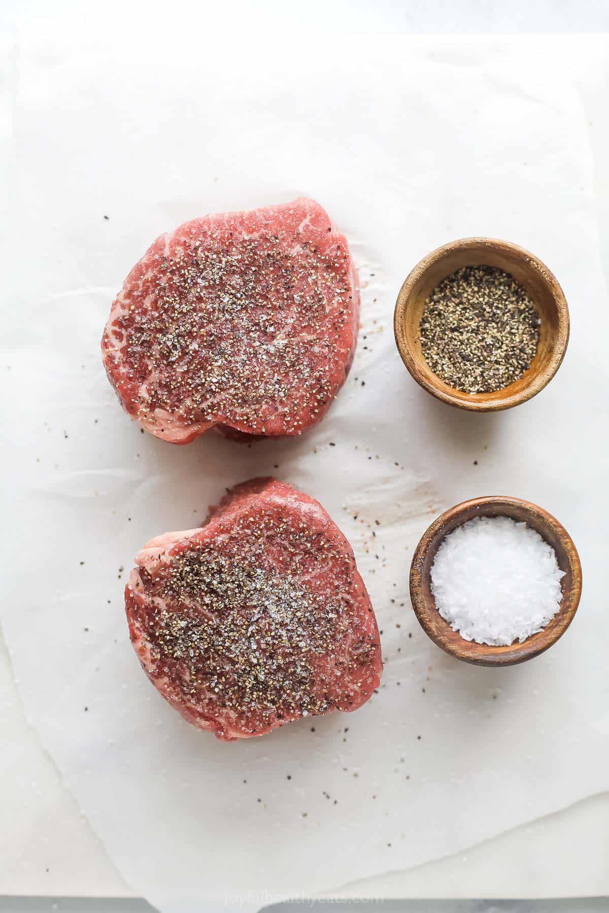 This 3-ingredient grilled filet mignon recipe is a juicy steak dinner you'll love for any weeknight or special occasions. Seasoning the steaks with salt and pepper.