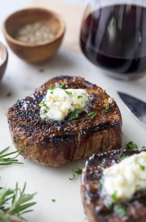 Grilled filet mignon with a knob of butter on top.