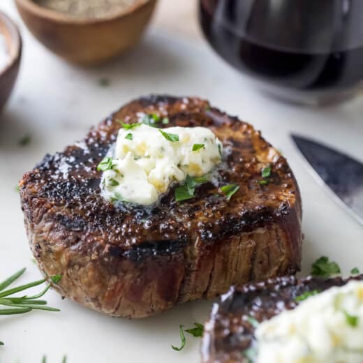 Grilled filet mignon with a knob of butter on top.