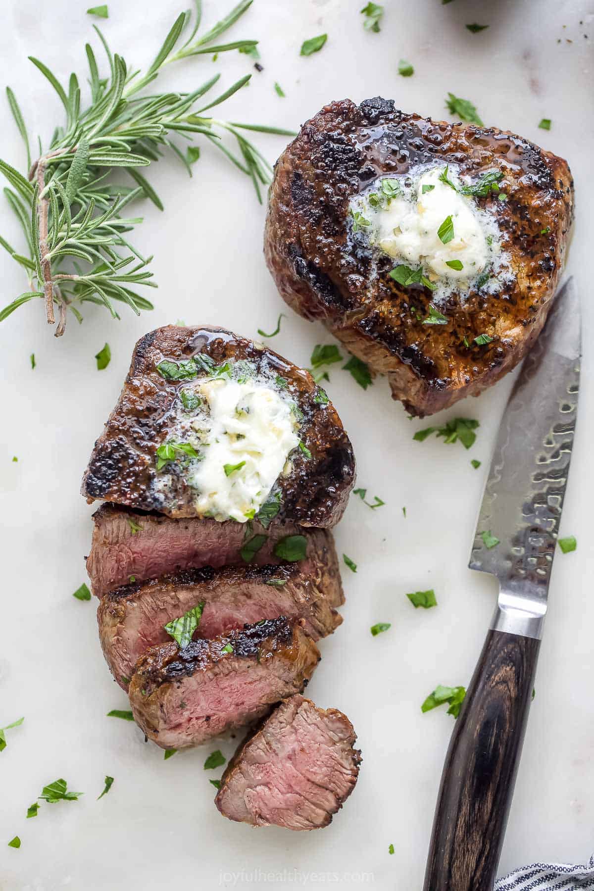 One whole grilled filet mignon and another sliced grilled filet mignon recipe.