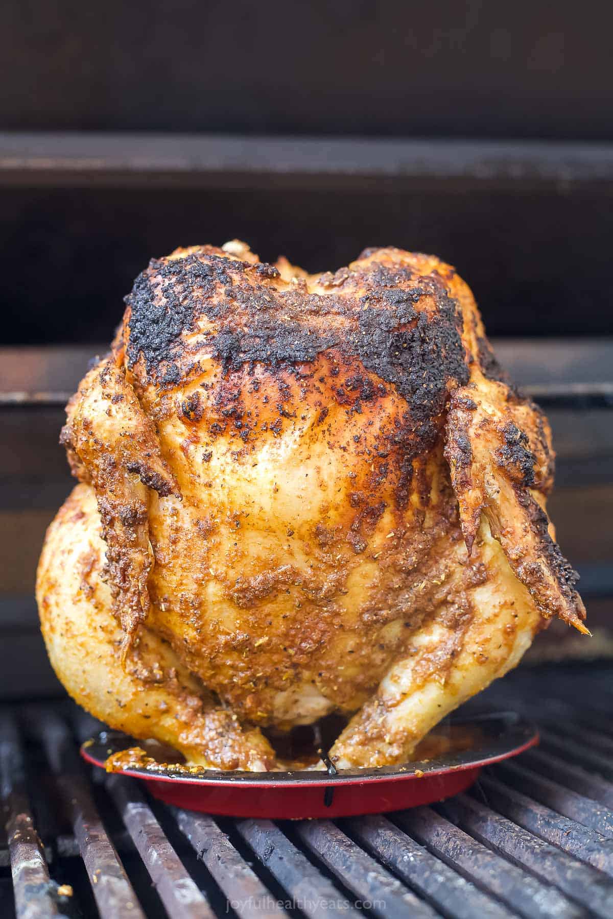 Grilled chicken on a vertical roaster.
