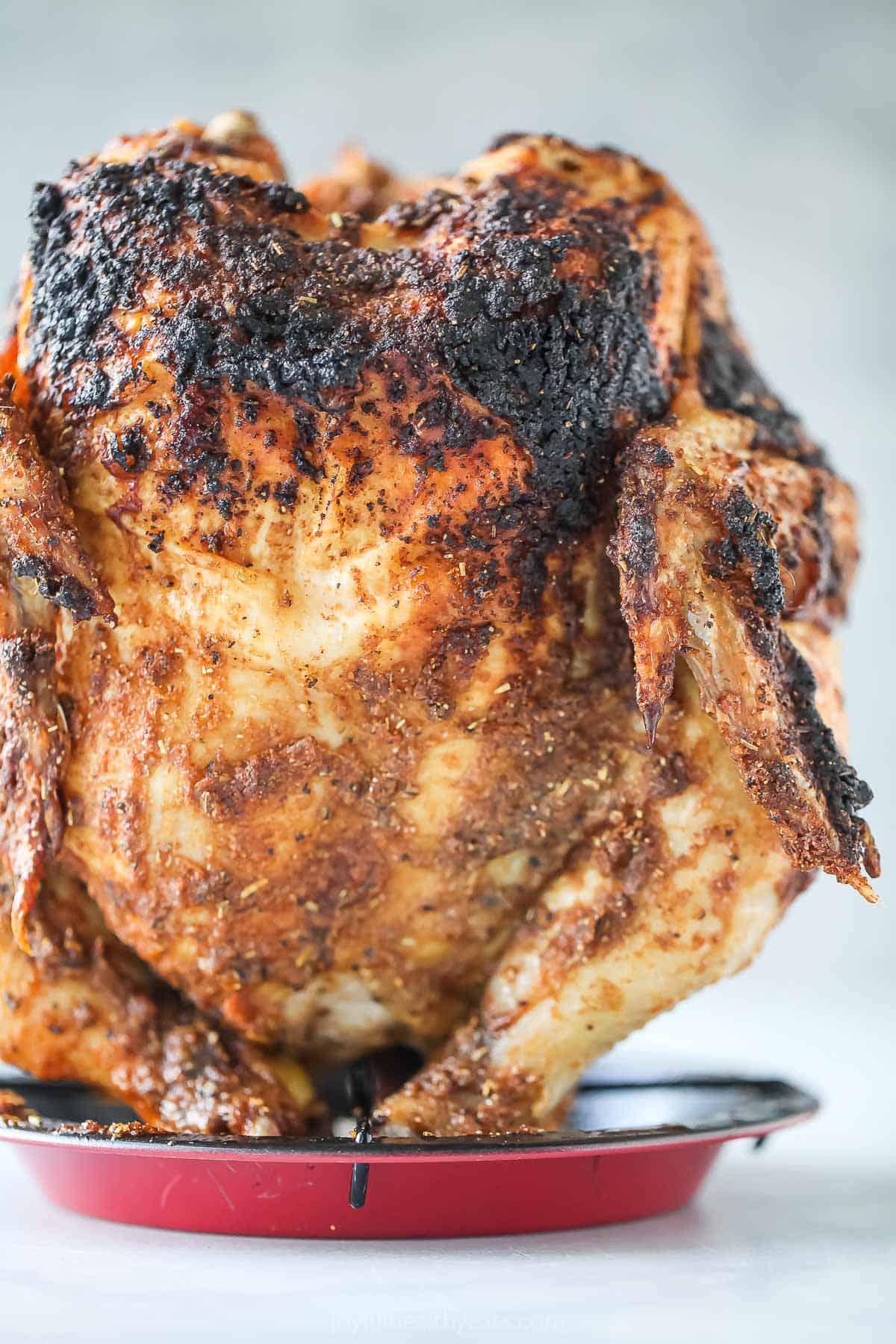 Vertically-standing grilled chicken. 
