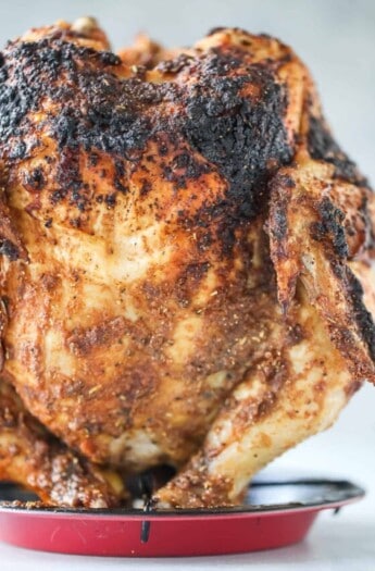 Vertically-standing grilled chicken.