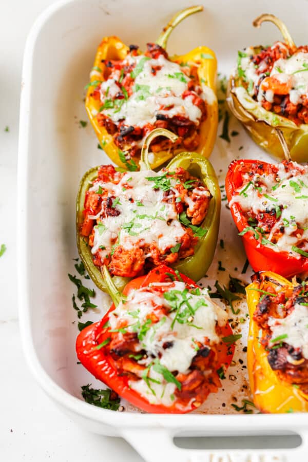 Close-up of Italian stuffed peppers with melty cheese.