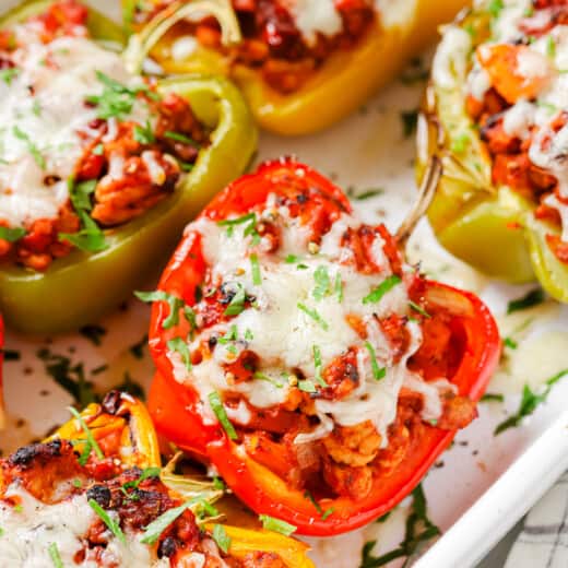 Close-up of Italian stuffed peppers in the baking dish.