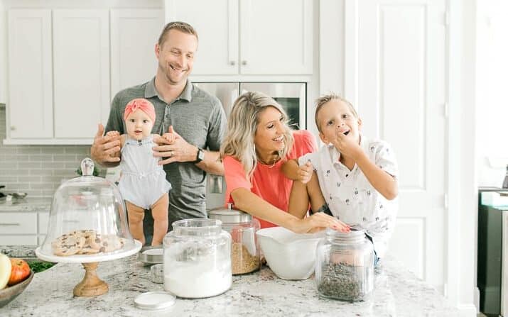 Krista with husband and two children in the kitchen