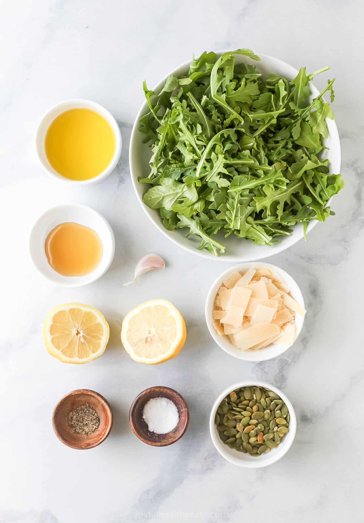 This arugula salad recipe with a sweet-and-sour vinaigrette will have you pushing the main dish aside for another serving. Ingredients for simple arugula salad.