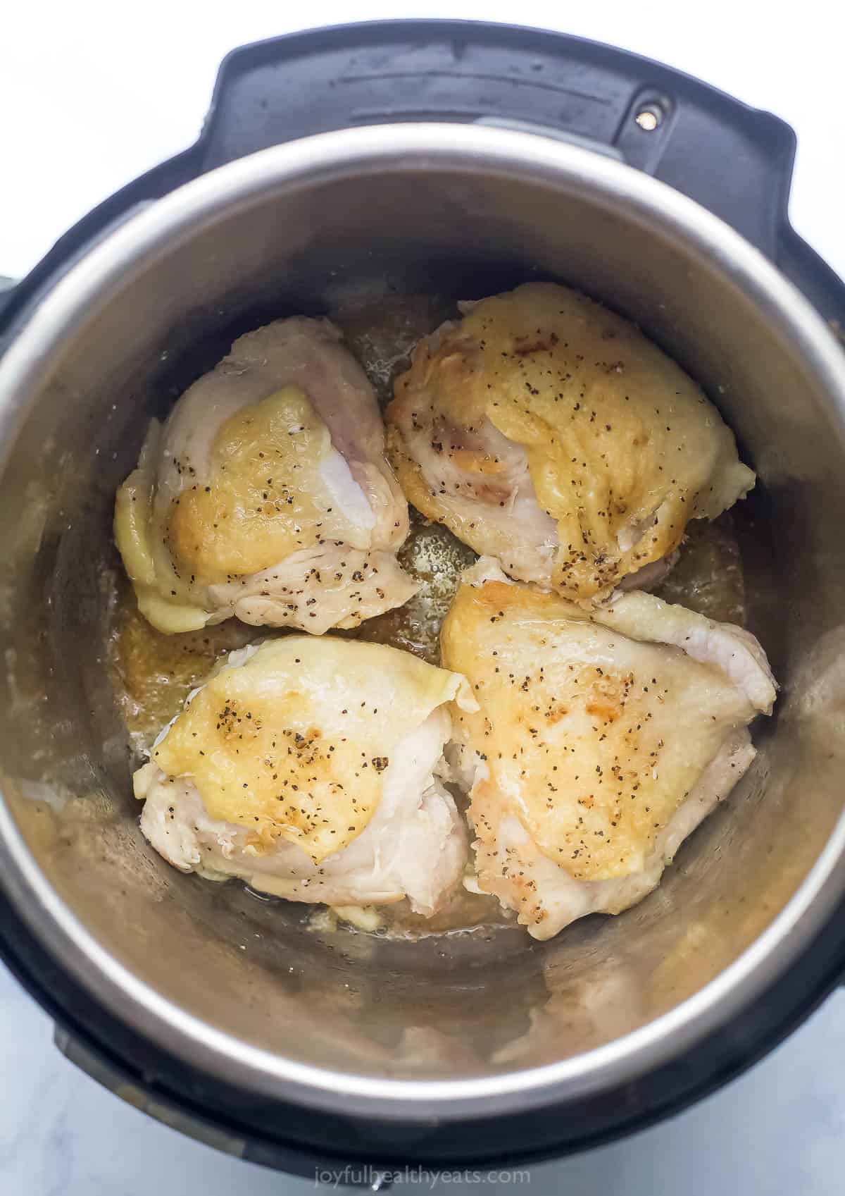 Browning the chicken in the Instant Pot. 
