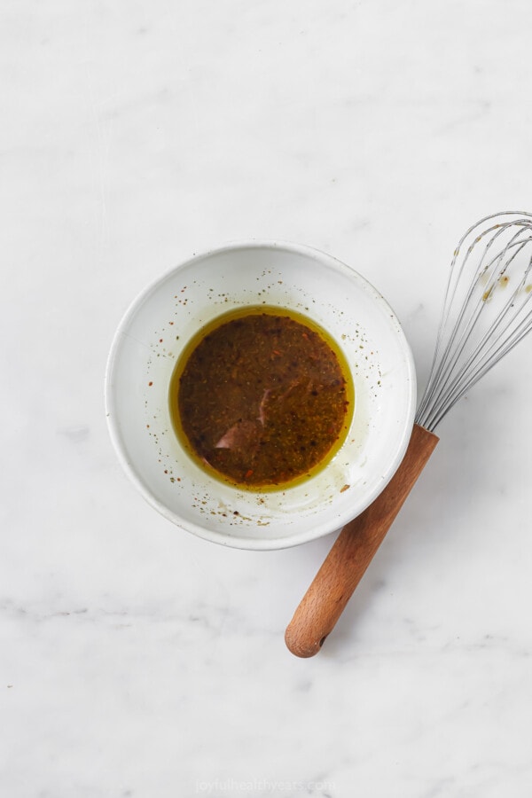 Dressing whisked in a bowl.