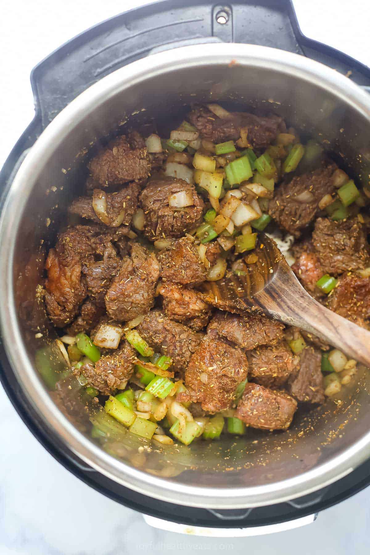 Cooked beef with celery and onions. 