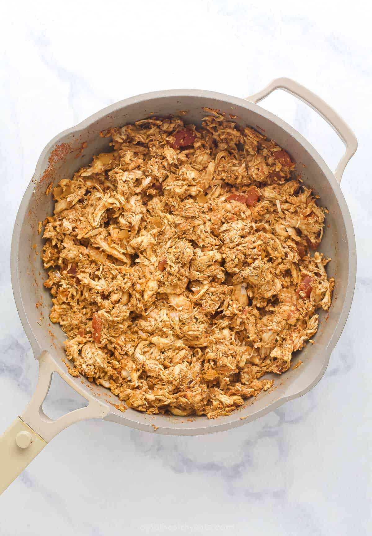 Prepared chicken filling with salsa in the pan. 