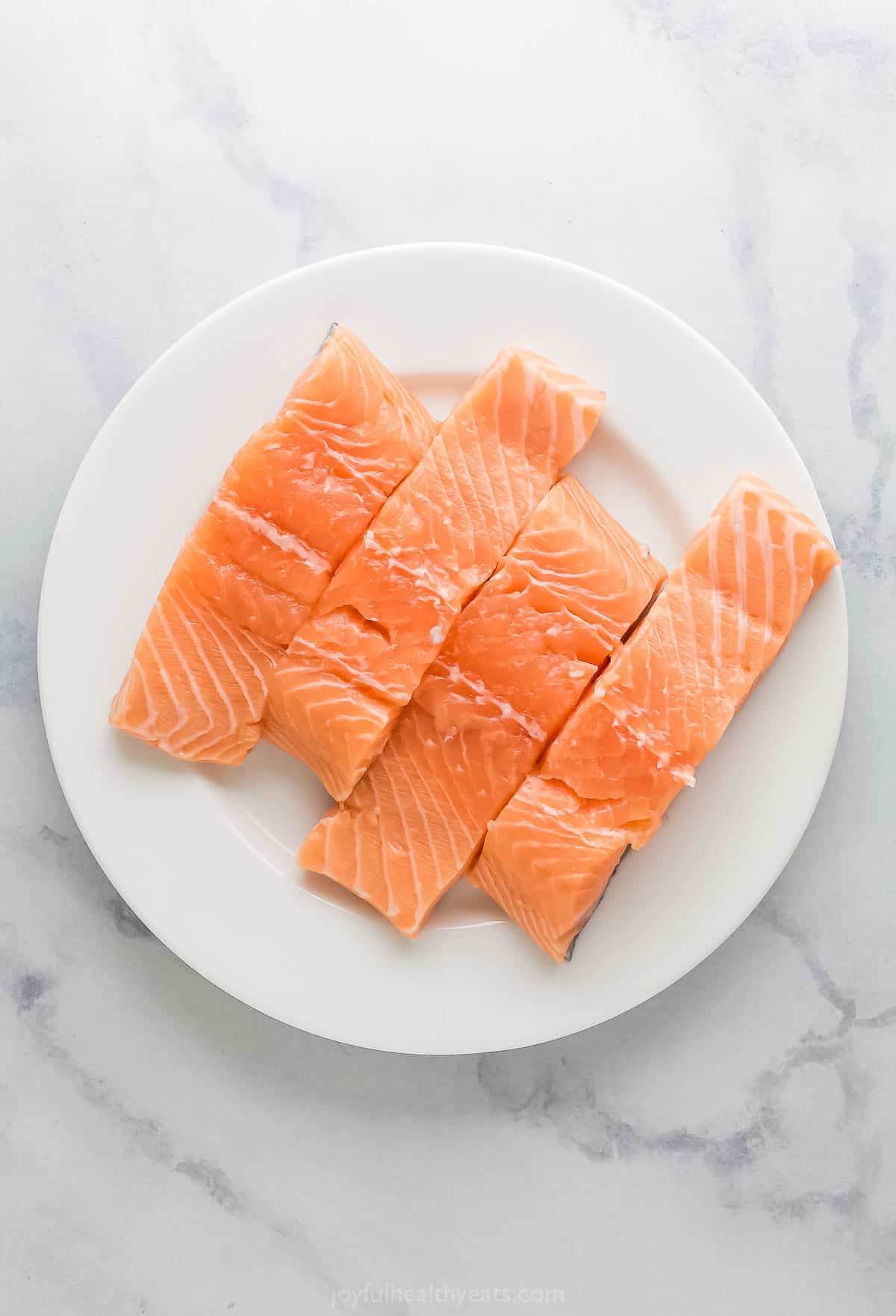 Fresh salmon filets on a plate. 