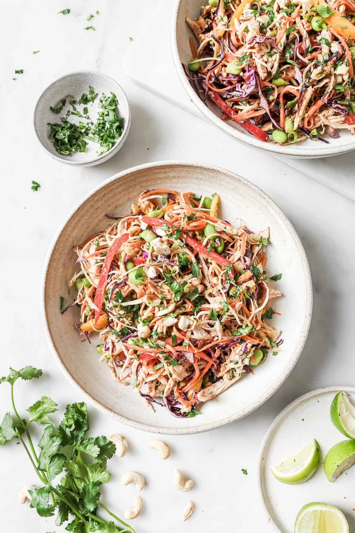 Two bowls filled with chopped Thai chicken salad
