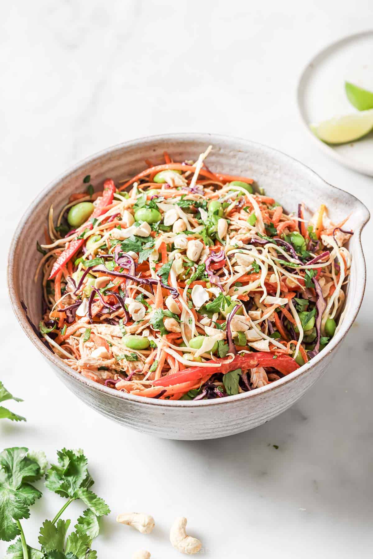 Bowl of chopped Thai chicken salad with peanut dressing