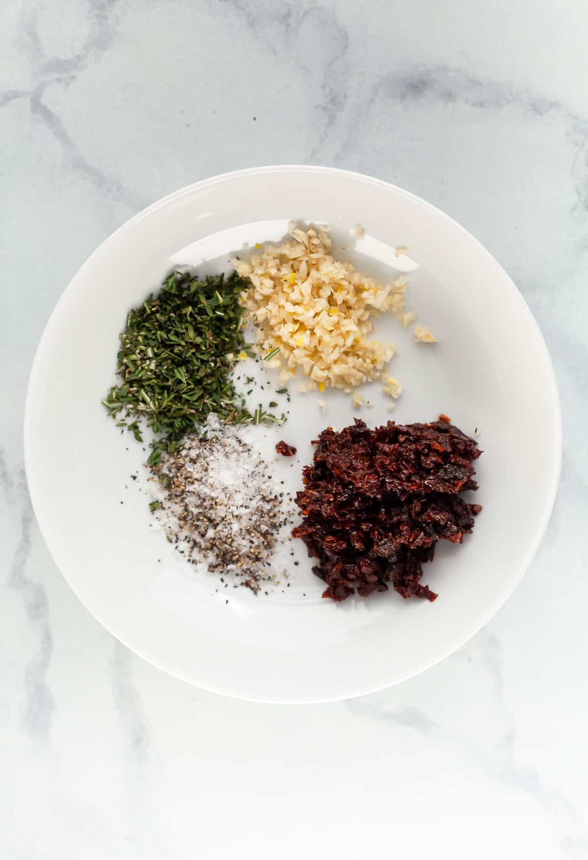 Herbs and seasonings in bowl for bread dipping oil